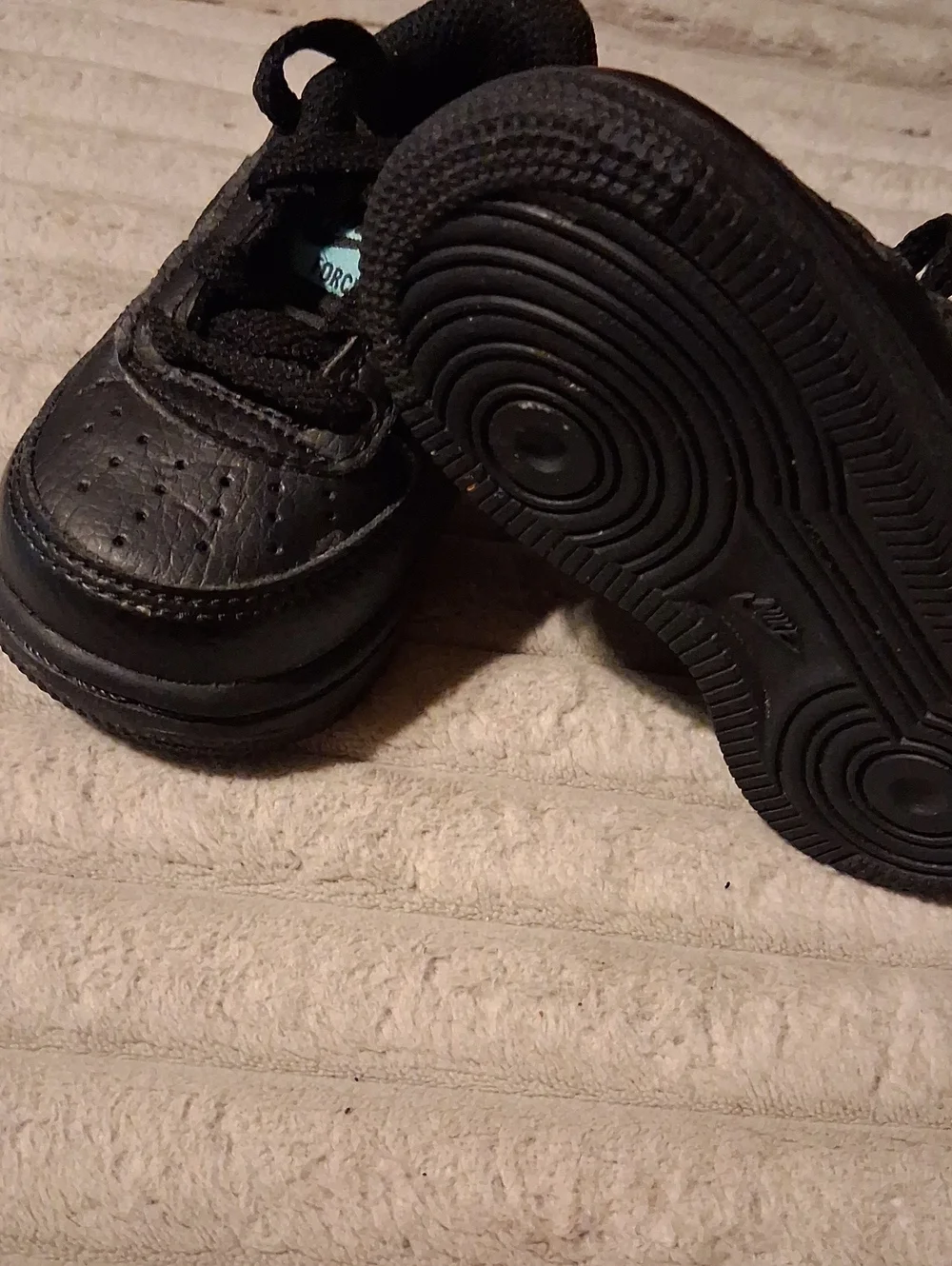 Nike Kids Black Sneakers with Blue Accents